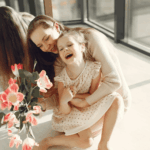 photo-of-mother-and-daughter-sitting-on-the-floor