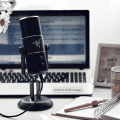 microphone on a desk with a laptop